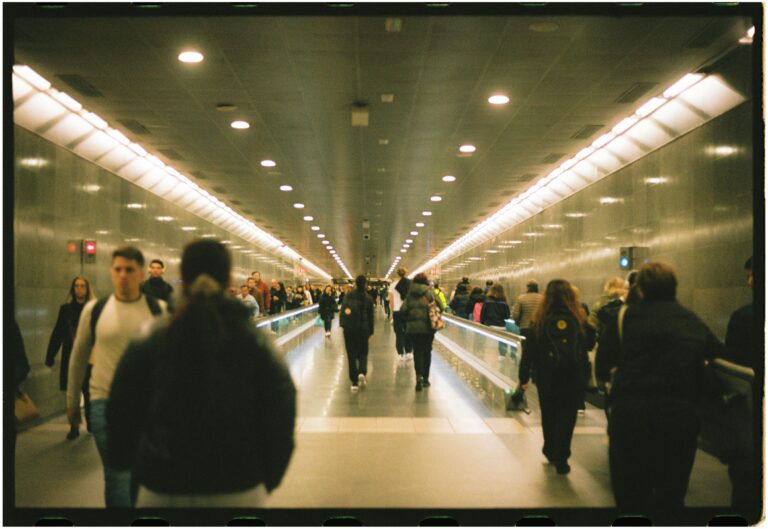 LiftNet Vertical Transportation Partnerships people on a moving walkway at an airport